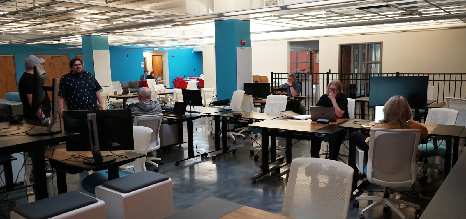 Members working and collaborating in the open space