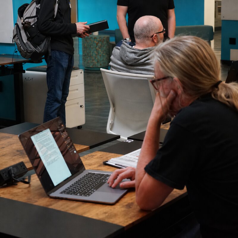 Member working at a laptop